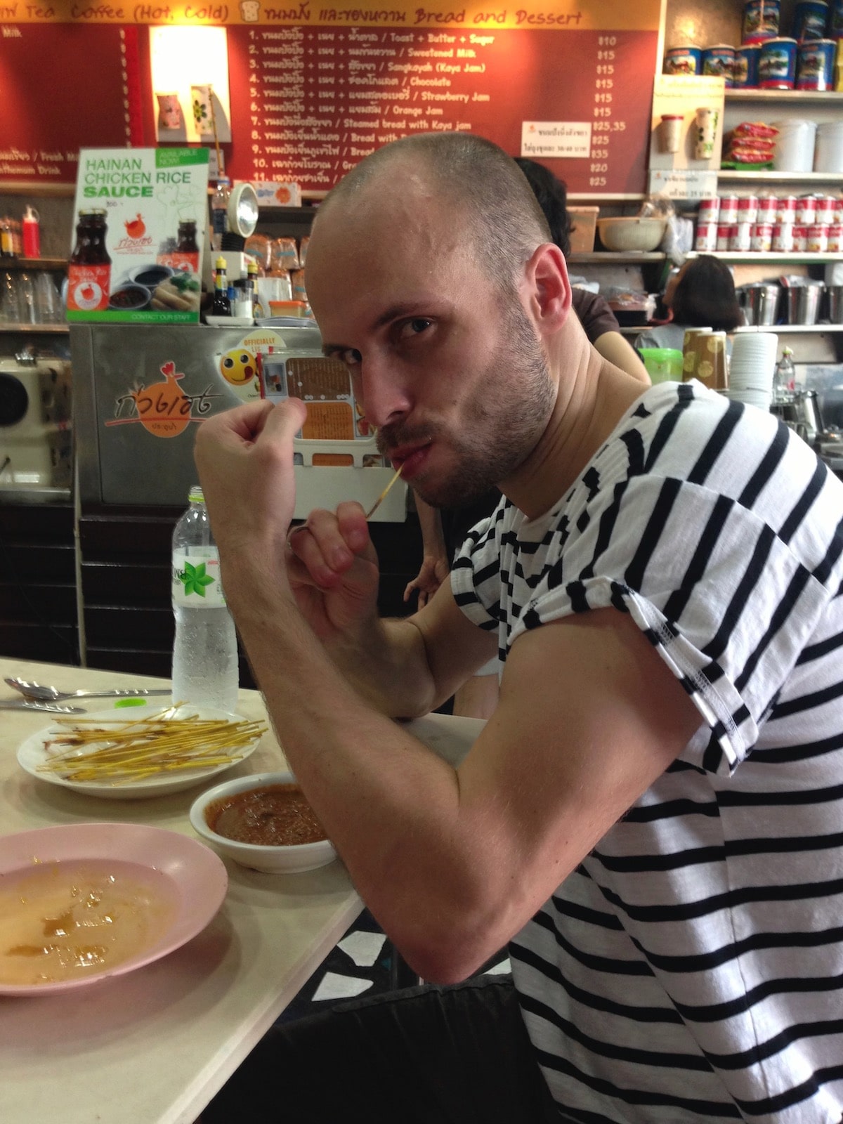 Cost of Living in Bangkok (& The Lies That Bloggers Tell) • cheap Thai food Tourist eating cheap Thai food in Bangkok