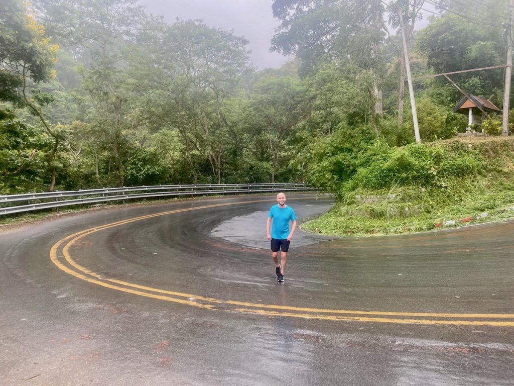 Msn in blue running on a rainy day