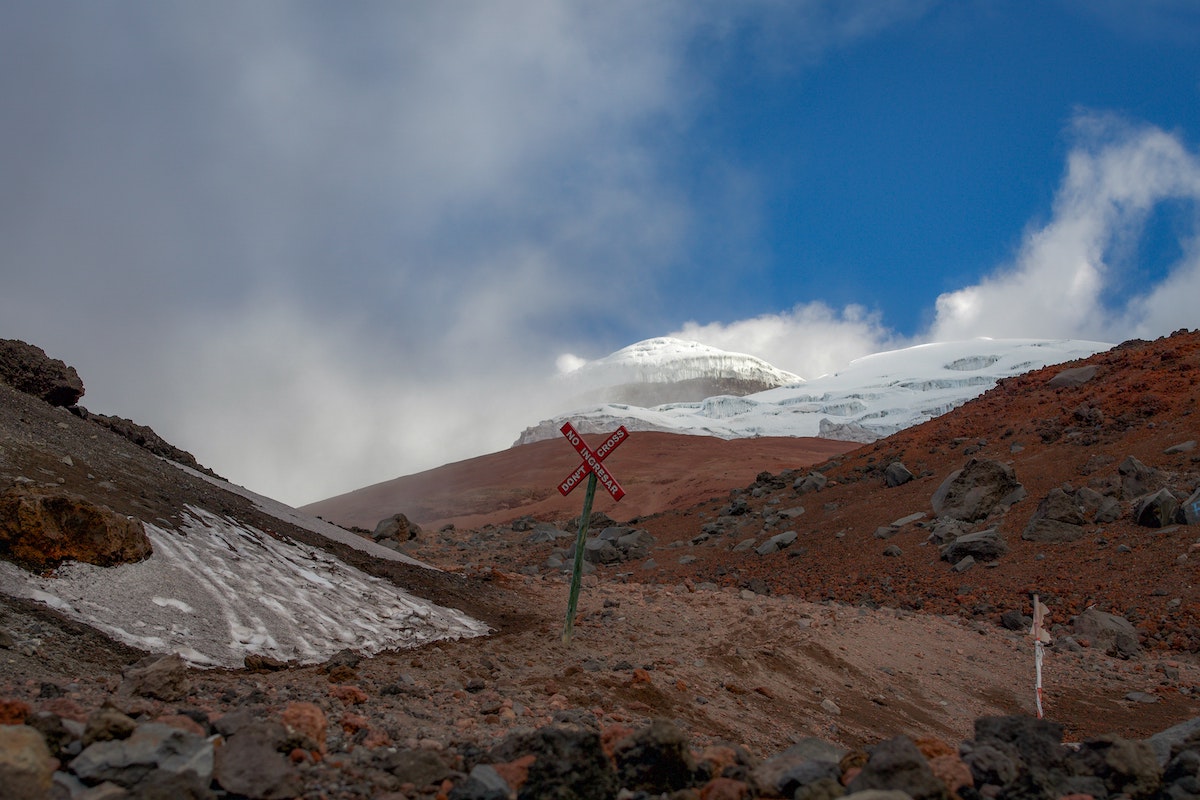 A dusted glacier on a brown mountain, Cotopaxi in Quito, Ecuador.