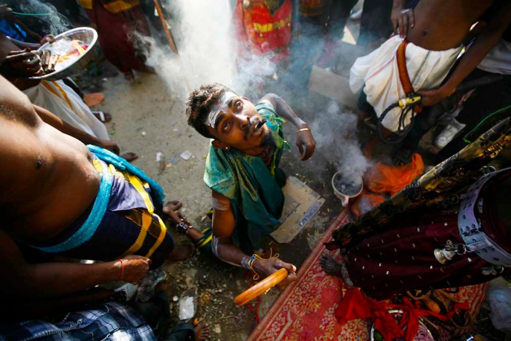 A Hindu devotee gets in a trance before he starts his pilgrimage to the sacred Batu Caves Temple during the Thaipusam festival in Batu Caves in Kuala Lumpur