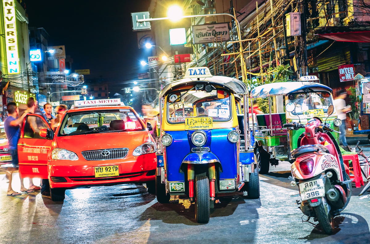 Cost of Living in Bangkok (& The Lies That Bloggers Tell) • Khao San Road Bangkok Road street life and traffic with tuk-tuk rickshaw taxis near Khao San Road Bangkok in Thailand