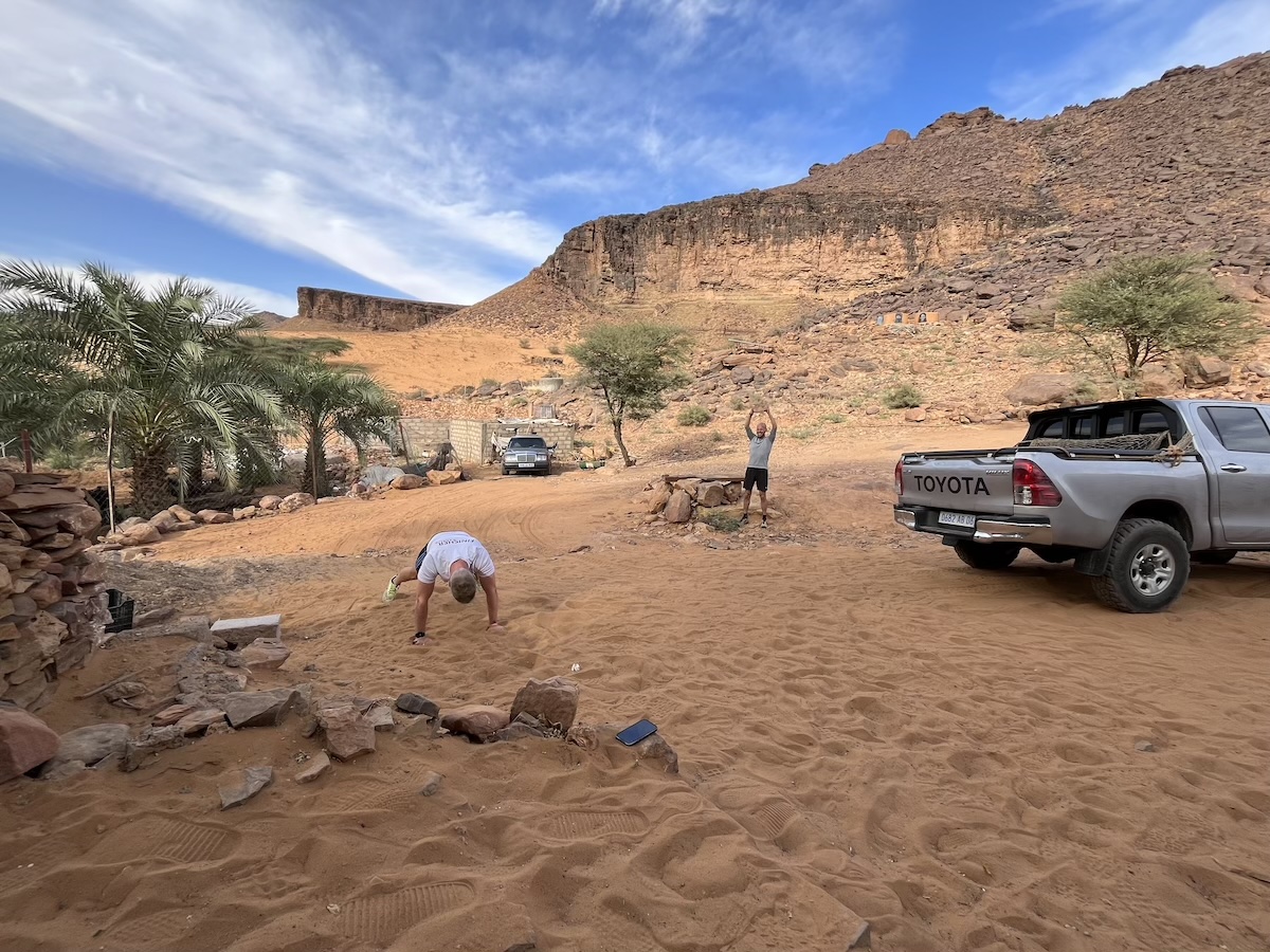Two men exercising in the desert of Mauritania 