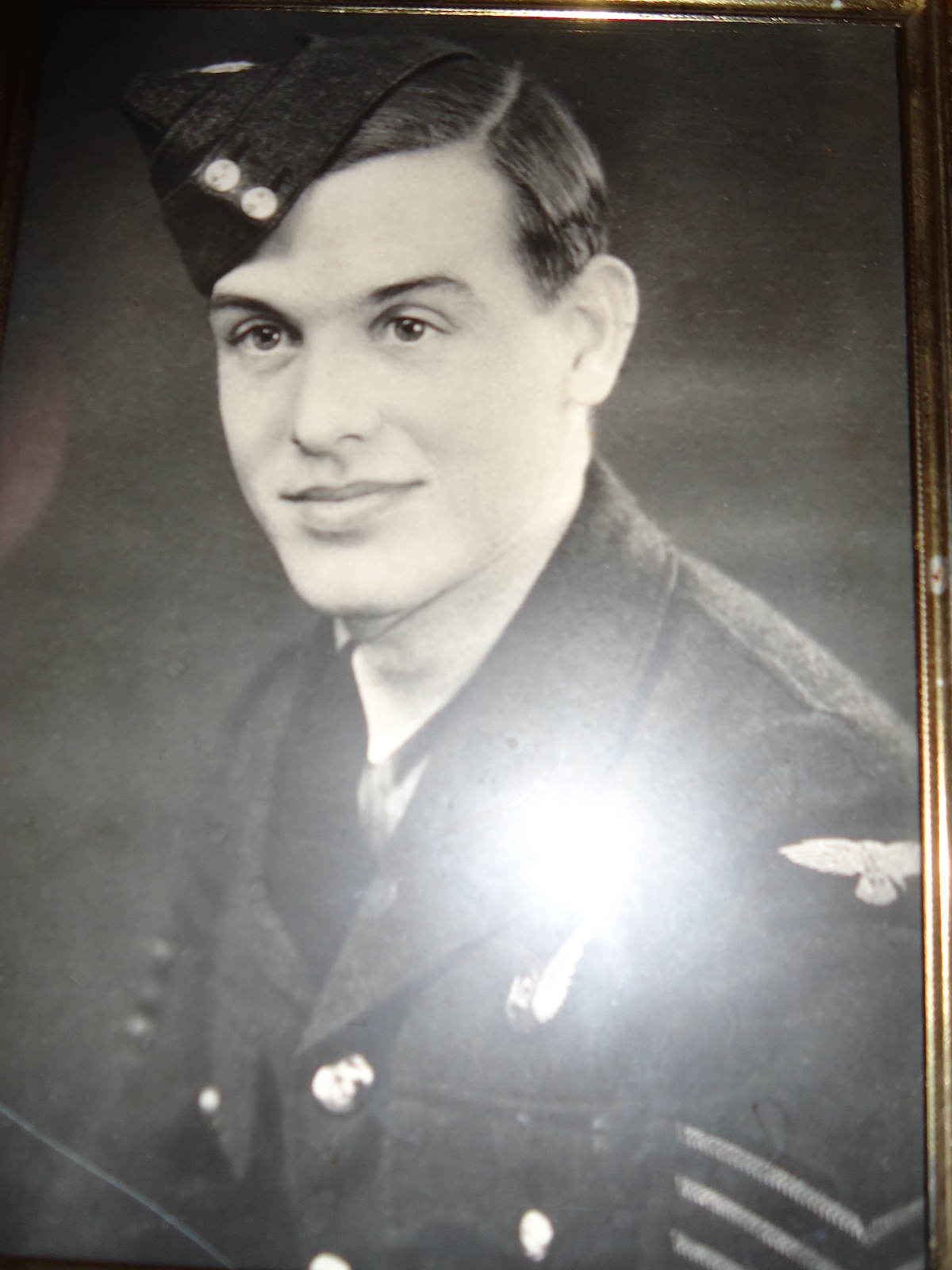 A black and white portrait photo of an ao force sergeant during World War 2. 