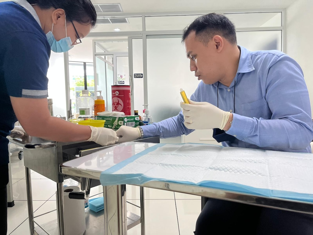 A doctor prepares a syringe 