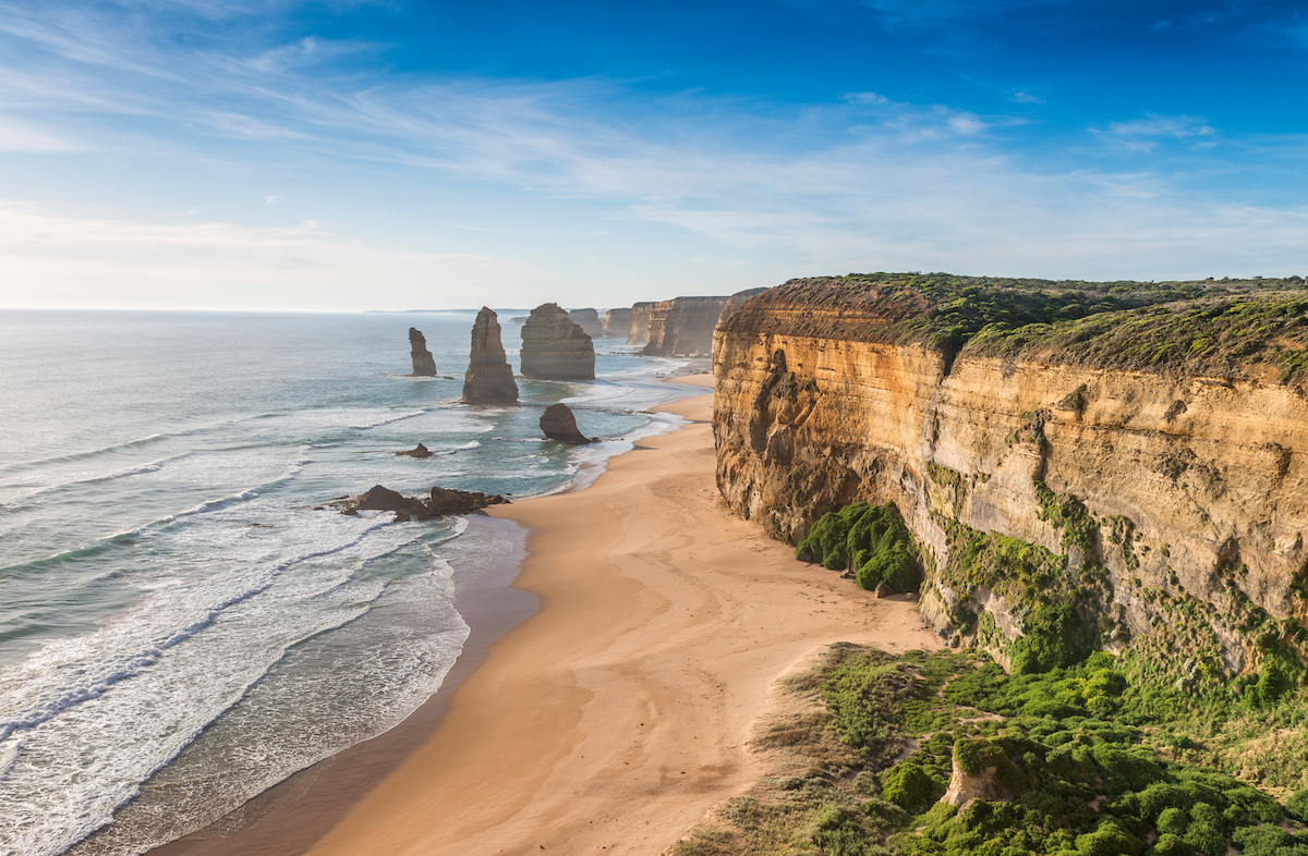 How To Plan The Ultimate Australia Road Trip in 2024 • great ocean road Cliffs overlooking the sea at sunset.