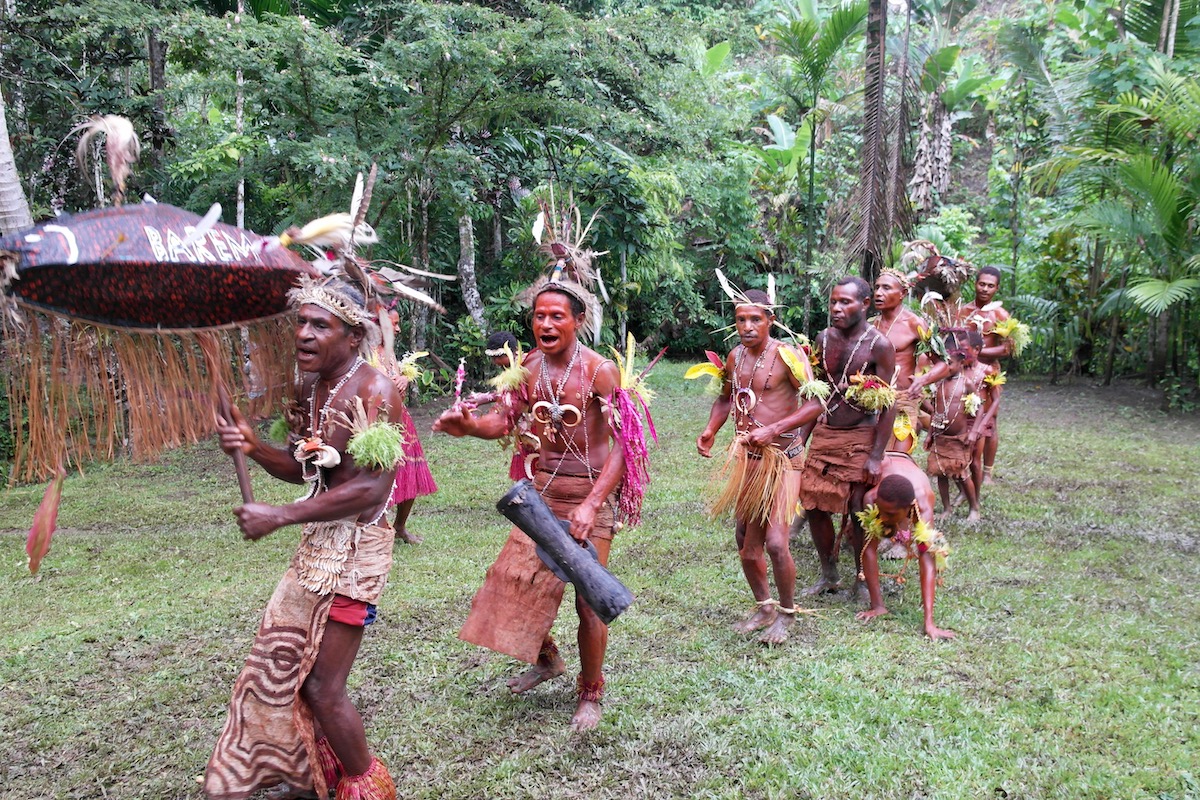 A tribe dances in the Papua New Guinea rainforest