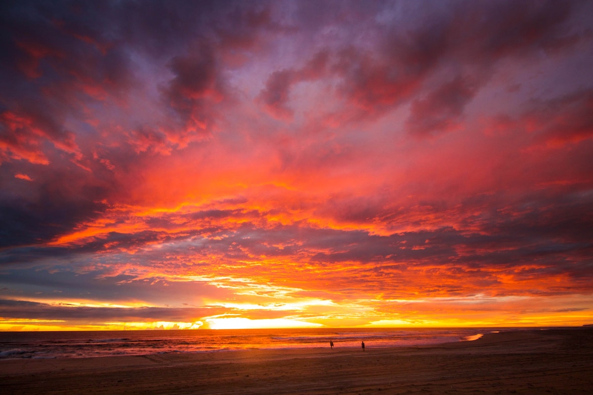 How To Plan The Ultimate Australia Road Trip in 2024 • sunset australia A red sky sunset.